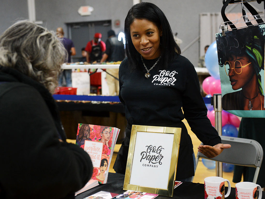 Kendra Jones talks with a customer at her